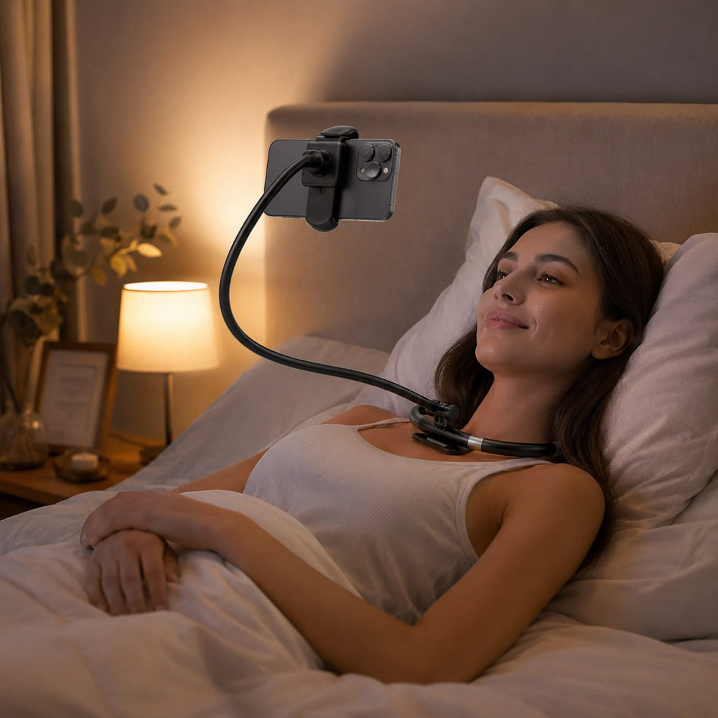 Woman lying in bed comfortably using the Halo neck phone mount for nighttime hands-free phone viewing.