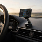 Luminomo Anchor mounted on car dashboard holding iPhone in premium driving setup