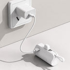 White Luminomo Go portable power bank charging from a USB-C wall charger.
